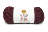 A ball of Lion Brand Jeans in colourway corduroy (deep purple/red with black and white slight marl look)