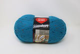 A ball of Red Heart Comfort yarn in shade teal fleck (bright medium blue teal with orange and black flecks)