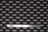 Flat swatch diamond fabric (black fabric with white, black and red diamond geometric design repeated in alternating space lines)