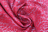 Swirled swatch red fabric (bright red marbled look fabric with silver metallic tree branch/scratch look pattern allover)