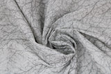 Swirled swatch snow fabric (white marbled look fabric with silver metallic tree branch/scratch look pattern allover)