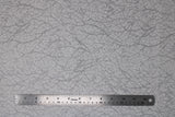 Flat swatch snow fabric (white marbled look fabric with silver metallic tree branch/scratch look pattern allover)