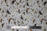 Flat swatch Parchment Birds fabric (white fabric with tossed coloured illustrative design birds and labels)