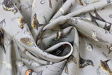 Swirled swatch Vintage Grey Birds fabric (grey fabric with tossed coloured illustrative design birds and labels)