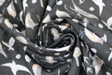 Swirled swatch Charcoal Birds fabric (charcoal grey fabric with tossed coloured illustrative design birds and labels)