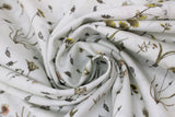 Swirled swatch Parchment Floral fabric (white fabric with loosely tossed floral and stems with leaves and greenery in yellow, pink, blue shades)