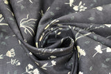Swirled swatch Charcoal Floral fabric (charcoal grey fabric with loosely tossed floral and stems with leaves and greenery in yellow, pink, blue shades)