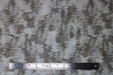 Flat swatch Parchment Feathers fabric (white fabric with faded beige grey chevron feather look design)