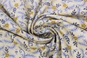 Group swatch assorted bee printed fabrics in various styles