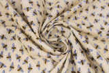 Swirled swatch assorted bee printed fabric in honey bees (pale yellow marbled fabric with tossed small bees allover)