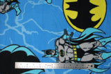 Flat swatch Batman licensed print on fleece (superhero, oval logos and lightning on medium blue)