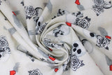 Swirled swatch white born to ride fabric (white fabric with tossed white skulls and roses, red hearts with white wings)