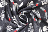 Swirled swatch black born to ride fabric (black distressed look fabric with tossed white skulls and roses, red hearts with white wings)