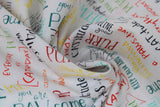 Swirled swatch Words White fabric (white fabric with tossed cat-related words and phrases allover in multi directions and various colours: "CATitude" "Purr-fect" etc.)