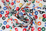 Swirled swatch man cave themed fabric in pool balls white (white fabric with tossed pool balls)