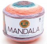 A cake of Lion Brand Mandala yarn in colourway pegasus (white, baby pink, pale coral, lavender, blue, grey)