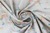 Swirled swatch Pink & Purple fabric (grey fabric with loosely tossed floral clusters and leaves allover in green, white, pink, purple, turquoise)