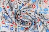 Swirled swatch tossed medical emblems on white faint grey grid pattern material (hearts, band aids, stethoscopes, masks, "Nurse" "hero" "Healing" etc texts)