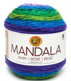 A cake of Lion Brand Mandala Baby yarn in colourway mermaid cove (dark blue, bright aqua, dark lime, bright medium green)