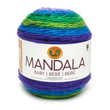 A cake of Lion Brand Mandala Baby yarn in colourway mermaid cove (dark blue, bright aqua, dark lime, bright medium green)