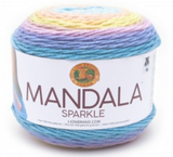 A cake of Lion Brand Mandala Sparkle yarn on white background in colourway orion (baby blue, pink, yellow, lavender, blue with metallic sparkles throughout)