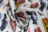 Swirled swatch Full Service Garage fabric (white fabric with garage sign emblems in full colour and old cars in black and white)