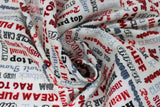 Swirled swatch Classic fabric (white fabric with garage related text allover in grey, black and red shades)