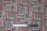 Flat swatch Classic fabric (white fabric with garage related text allover in grey, black and red shades)