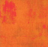 Grunge distressed-look fabric swatch in medium orange/pink shade