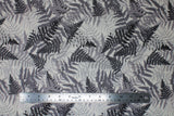 Flat swatch Charcoal fabric (light grey fabric with busy collaged tossed forest tree look leaves allover in various tones of grey)