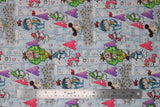 Flat swatch magical themed printed fabric in print castles (light blue/grey fabric with tiled castles with some pink and purple bricks, cartoon fairies, unicorns, dragons and knights in various colours)