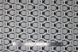 Flat swatch Moon fabric (white fabric with alternating direction lines of sleepy barn owls in white and black)