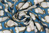 Swirled swatch Lake fabric (deep blue fabric with alternating direction lines of sleepy barn owls in beige and brown)
