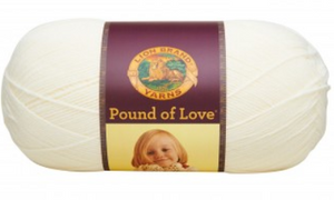 A ball of Lion Brand Pound of Love yarn on white background in an off white shade
