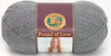 A ball of Lion Brand Pound of Love yarn on white background in shade oxford grey