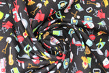 Swirled swatch camping toss fabric (black fabric with tiny full colour camping emblems tossed allover: campers, kayaks, BBQs, guitars, fire, chair, flashlight, etc.)