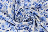 Swirled swatch light blue fabric (off white fabric with blue floral heads and leaves allover small/medium size)