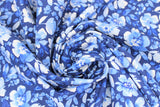 Swirled swatch dark blue fabric (dark blue fabric with light blue and white floral heads and leaves allover small/medium size)