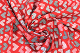 Swirled swatch Red Patchwork Hearts fabric (red fabric with hearts allover in patchwork style in white, black and red colours)