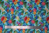 Flat swatch Floral fabric (light blue fabric with busy tossed floral and greenery with tossed frogs and butterflies in full colour)
