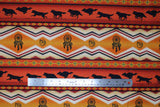 Flat swatch Terracotta fabric (horizontal striped southwest style fabric with geometric shapes, wolf silhouettes, dream catchers, etc. and yellow, orange and red tones)