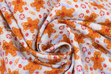 Swirled swatch Gingerbread fabric (white and light blue subtle marbled look fabric with tossed gingerbread cats making snow angels and tossed red and white candies, red paw prints, fish bones)