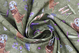 Swirled swatch Moss fabric (dark green fabric with small tossed garden related emblems allover in full colours: purple/green boots, purple flowers and butter flies, brown fences and wheel barrows, assorted garden tools, etc.)