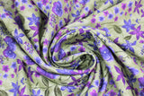 Swirled swatch celery fabric (green fabric with tossed purple floral heads in various styles with dark green stems and leaves tossed allover)