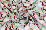 Swirled swatch Snowmen fabric (pale grey fabric with tossed white snowmen allover in black top hats or red and green winter hats, with red scarves and stockings and birds)