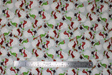 Flat swatch Snowmen fabric (pale grey fabric with tossed white snowmen allover in black top hats or red and green winter hats, with red scarves and stockings and birds)