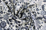 Swirled swatch blooming linen fabric (off white fabric with busy black floral design allover decorative black floral and leaves with fruit and patterns/designs in white within the black)