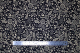 Flat swatch blooming nightfall fabric (black fabric with beige floral outlines and shapes allover with black details within, floral heads, leaves, fruit, etc.)
