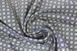 Swirled swatch nightfall link fabric (dark grey/black fabric with beige tiled/linked look and beige squares tilted to look like diamonds on intersecting points)