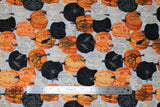 Flat swatch Tossed Pumpkins fabric (light grey fabric with tossed black, orange and white pumpkins with ornate style decorative patterns on pumpkins and tossed birds, trees and spiders)